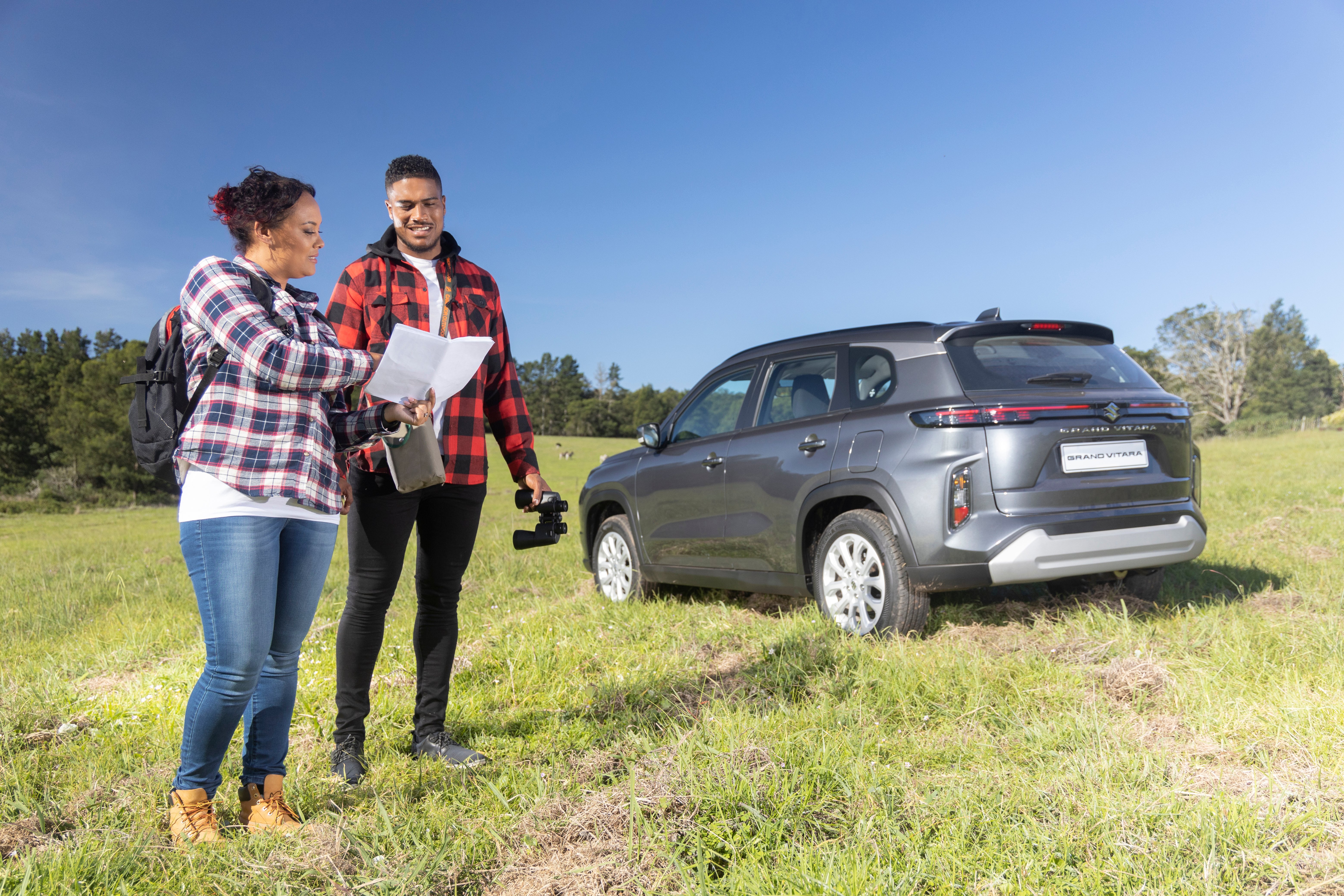 Suzuki Grand Vitara man and woman looking at map