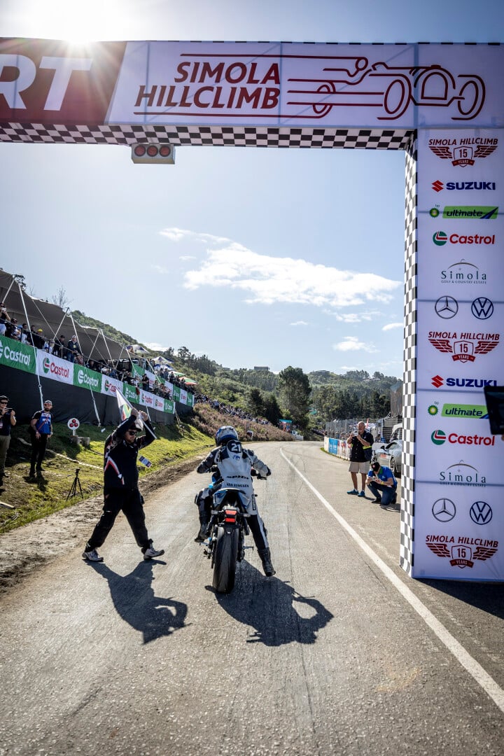 Biker under finish line arch
